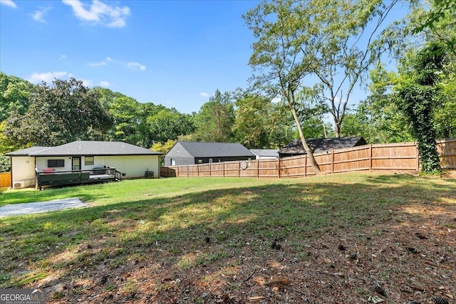 view of yard featuring a wooden deck