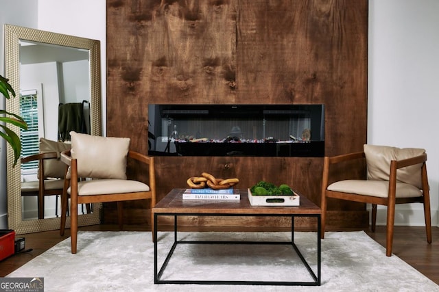 sitting room featuring wood-type flooring