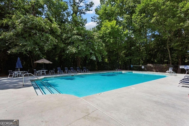 view of pool featuring a patio