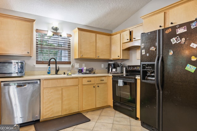 kitchen with lofted ceiling, sink, black appliances, a textured ceiling, and light brown cabinetry