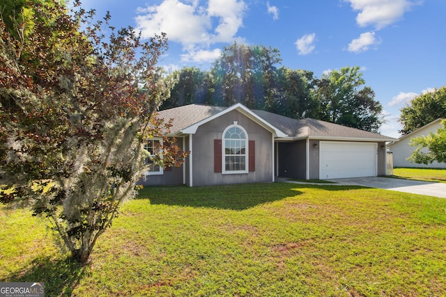 ranch-style home featuring a garage and a front yard