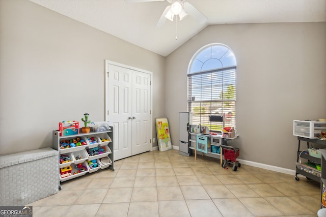 game room with light tile patterned flooring, lofted ceiling, and ceiling fan