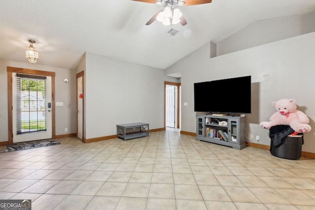 unfurnished living room featuring light tile patterned floors, vaulted ceiling, and ceiling fan