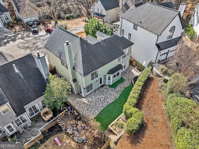 birds eye view of property with a residential view