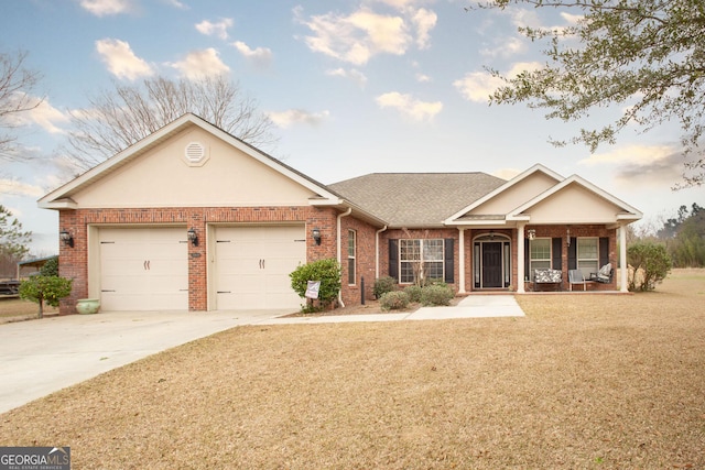 single story home with a garage, covered porch, and a front lawn