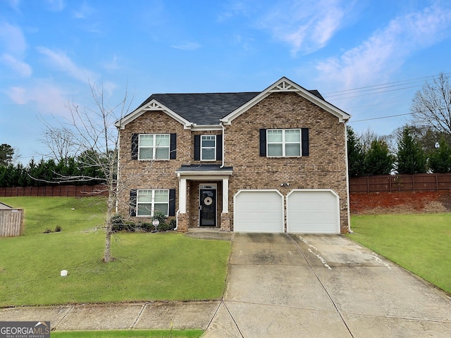 view of front of house with a garage and a front yard