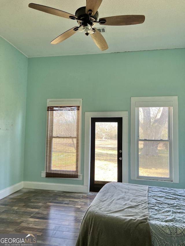 bedroom featuring ceiling fan and dark hardwood / wood-style flooring