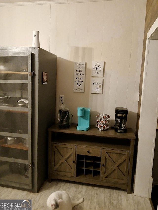 details featuring stainless steel fridge and hardwood / wood-style floors