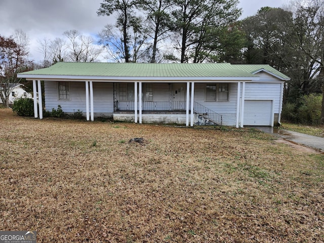 view of front of house featuring a garage and covered porch