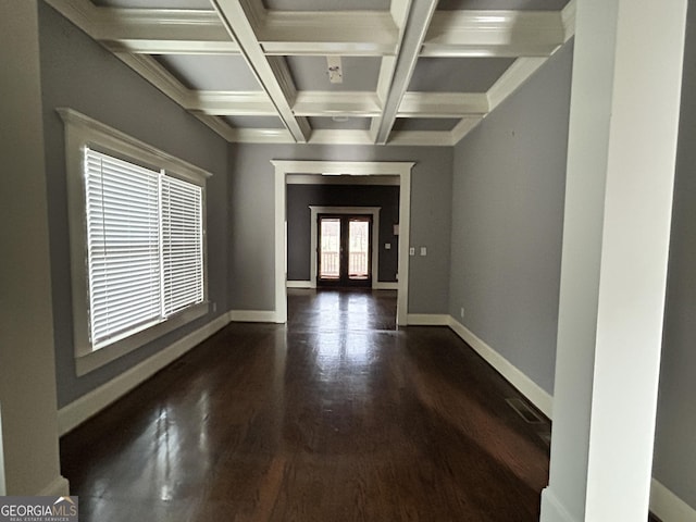 entryway with coffered ceiling, beam ceiling, dark hardwood / wood-style flooring, and french doors