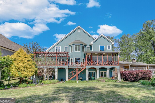 6780 Lawson Cir, Gainesville, GA 30506 - back of property featuring a pergola, a lawn, stucco siding, a sunroom, and stairs