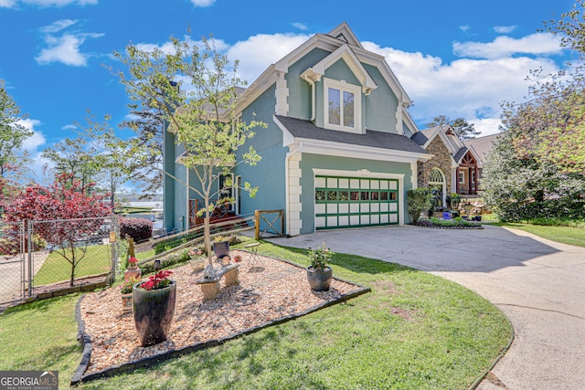 6780 Lawson Cir, Gainesville, GA 30506 - view of front of house with fence, a front lawn, concrete driveway, an attached garage, and stucco siding