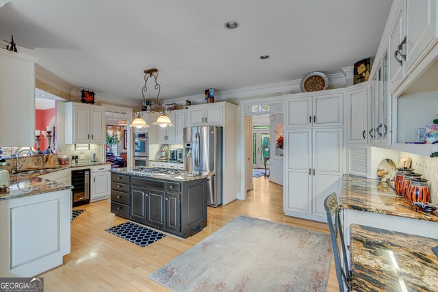 6780 Lawson Cir, Gainesville, GA 30506 - kitchen featuring white cabinets, beverage cooler, stainless steel appliances, and a sink