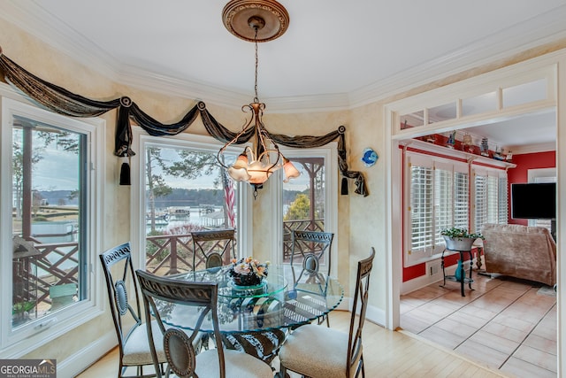 6780 Lawson Cir, Gainesville, GA 30506 - dining space featuring light wood-style flooring, ornamental molding, baseboards, and a notable chandelier