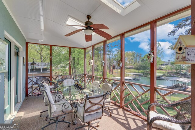 6780 Lawson Cir, Gainesville, GA 30506 - sunroom / solarium featuring a skylight, plenty of natural light, a ceiling fan, and a water view