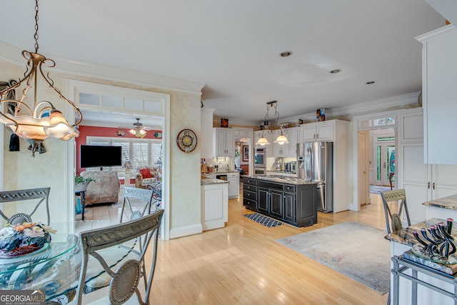 6780 Lawson Cir, Gainesville, GA 30506 - kitchen with light wood-type flooring, pendant lighting, ceiling fan, stainless steel refrigerator with ice dispenser, and ornamental molding