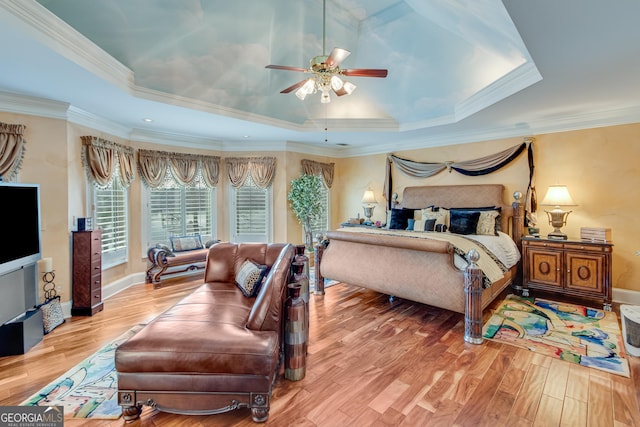 6780 Lawson Cir, Gainesville, GA 30506 - bedroom with baseboards, wood finished floors, a tray ceiling, and ornamental molding