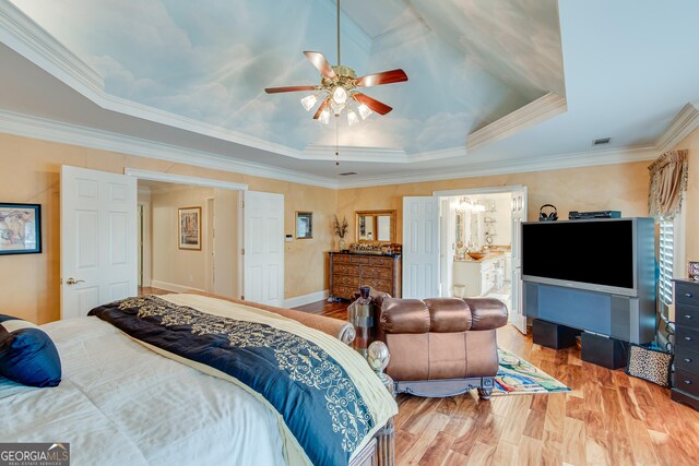 6780 Lawson Cir, Gainesville, GA 30506 - bedroom with a raised ceiling, wood finished floors, visible vents, a ceiling fan, and crown molding