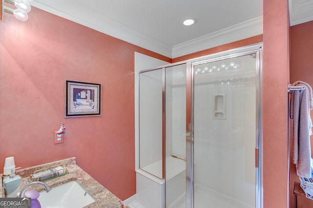 6780 Lawson Cir, Gainesville, GA 30506 - bathroom with a shower stall, ornamental molding, and a sink