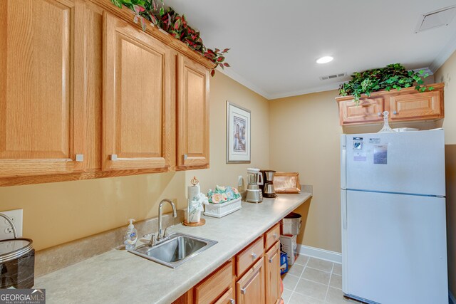 6780 Lawson Cir, Gainesville, GA 30506 - kitchen with crown molding, a sink, visible vents, and freestanding refrigerator