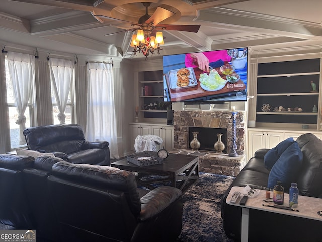 living room with ornamental molding, coffered ceiling, built in features, and a fireplace