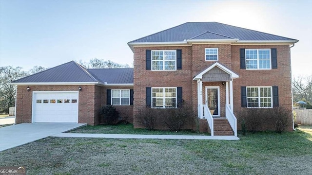 view of front of house with a garage and a front yard