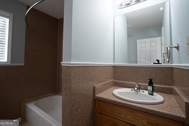 bathroom with vanity and shower / tub combination