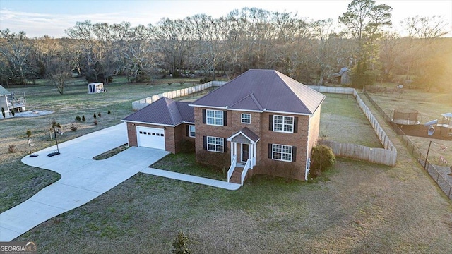 view of front facade featuring a yard and a garage