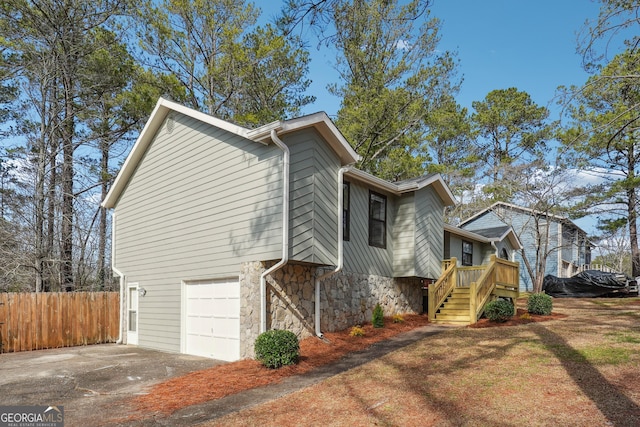 view of side of home with a garage