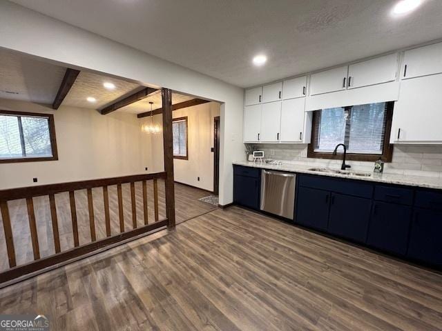 kitchen with sink, dark wood-type flooring, dishwasher, backsplash, and white cabinets