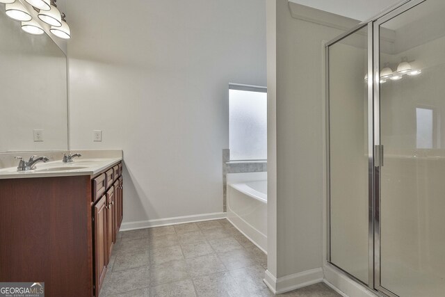 full bath featuring a garden tub, baseboards, a stall shower, and vanity