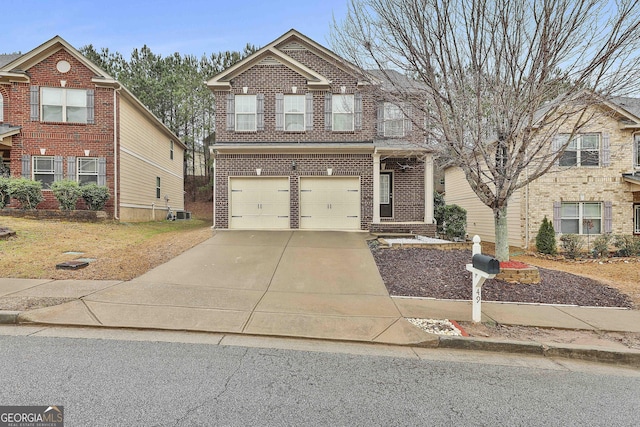 view of exterior entry featuring driveway, an attached garage, and brick siding