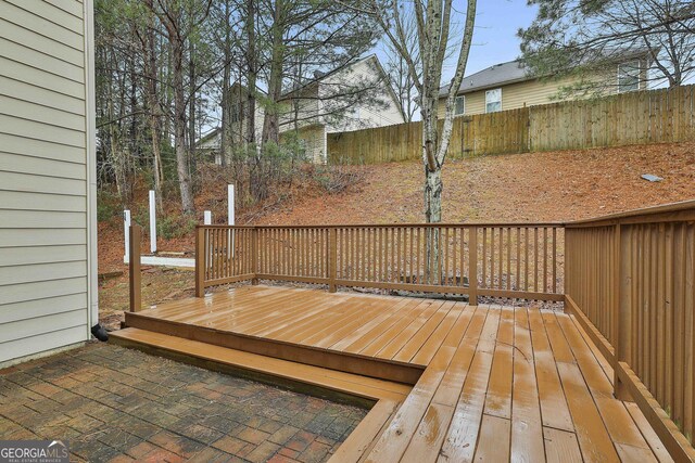 wooden deck featuring fence