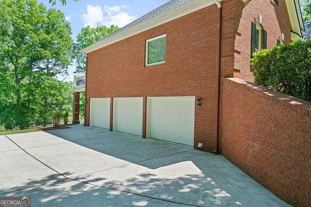 view of side of home with a garage