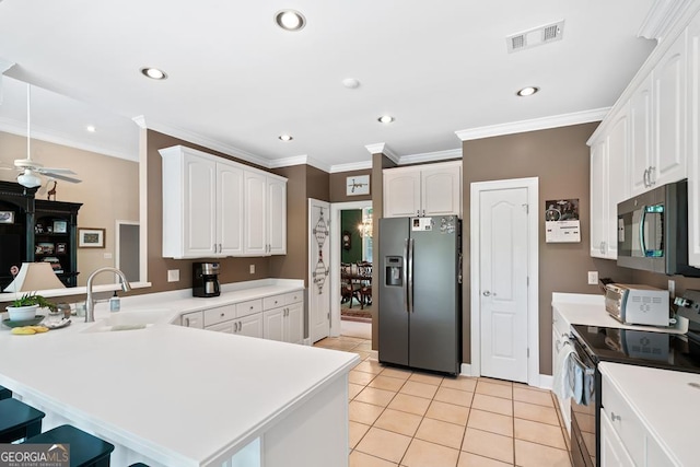 kitchen featuring sink, stainless steel fridge with ice dispenser, electric range, and kitchen peninsula