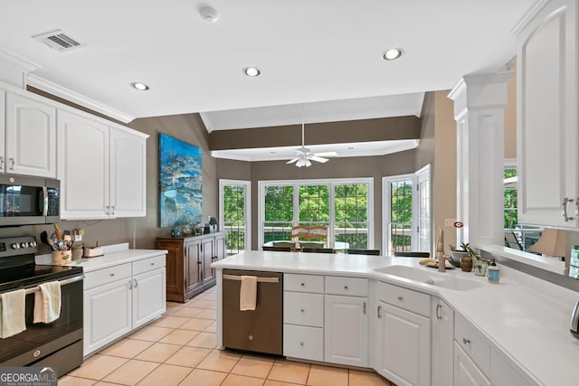 kitchen featuring crown molding, appliances with stainless steel finishes, sink, and white cabinets