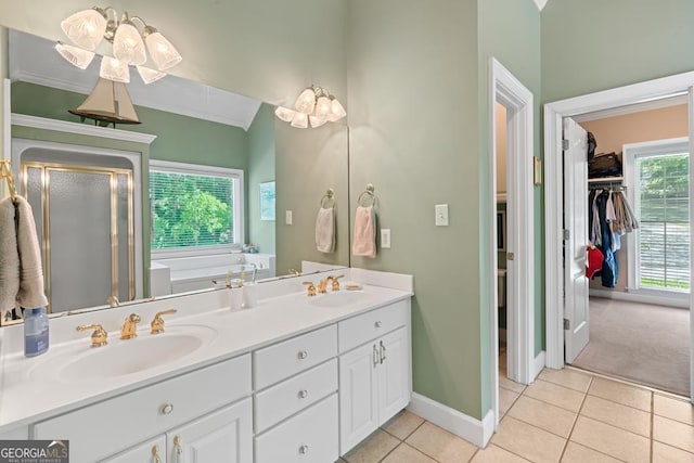 bathroom with tile patterned flooring, vanity, crown molding, and independent shower and bath