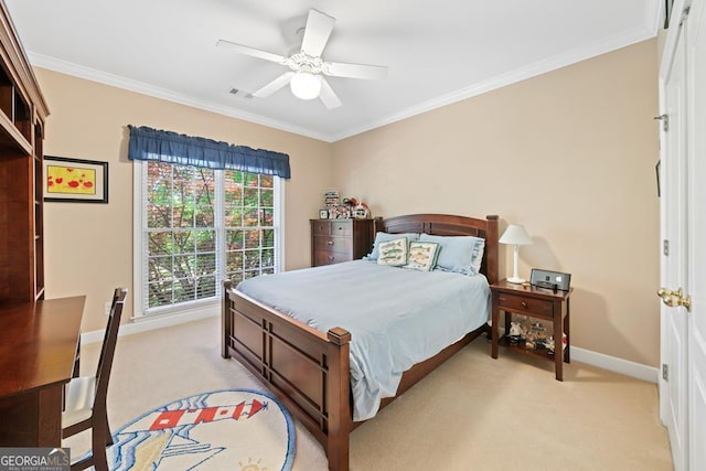 bedroom featuring ornamental molding, light colored carpet, and ceiling fan