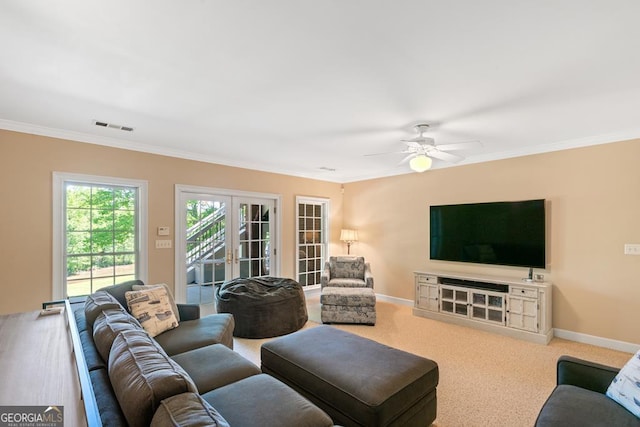 living room featuring crown molding, carpet floors, french doors, and ceiling fan