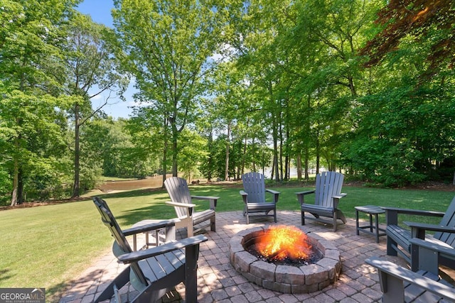 view of patio with a fire pit