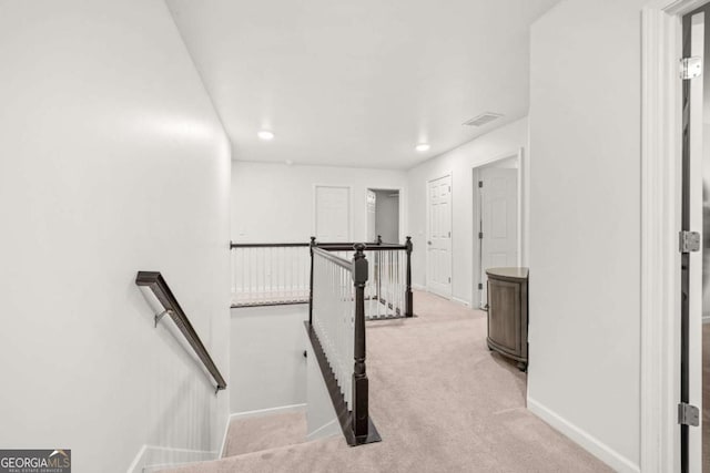 stairway featuring recessed lighting, carpet flooring, visible vents, and baseboards