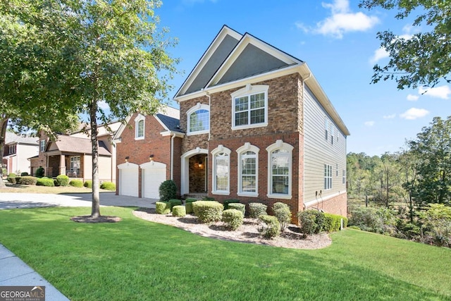 view of front of home with a garage and a front lawn