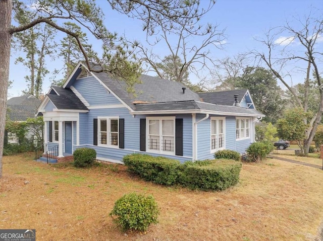 view of property exterior featuring a lawn