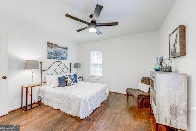 bedroom featuring ceiling fan and hardwood / wood-style floors