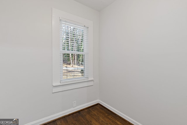 empty room with wood-type flooring