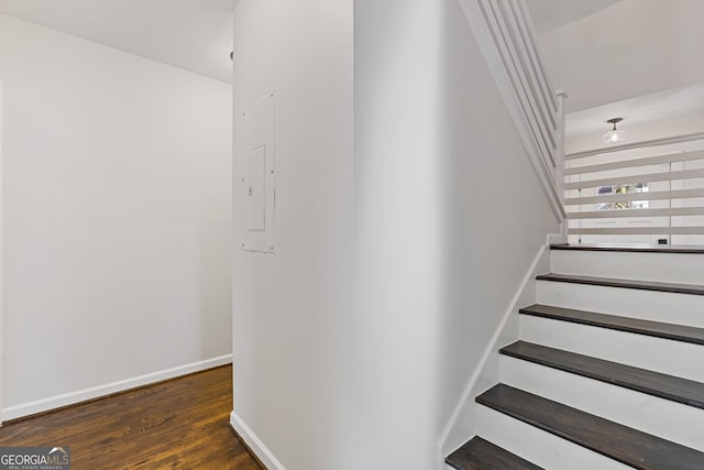stairs featuring hardwood / wood-style flooring