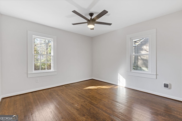 spare room with wood-type flooring and ceiling fan