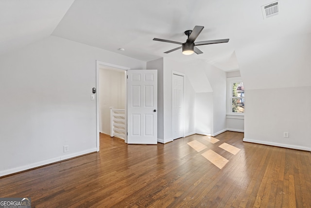 bonus room featuring vaulted ceiling, dark hardwood / wood-style floors, and ceiling fan