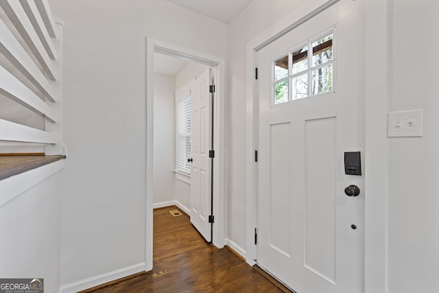 foyer with dark hardwood / wood-style flooring