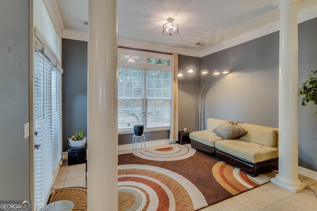 sitting room with decorative columns, crown molding, and plenty of natural light